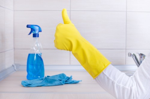 Technician cleaning a lounge sofa in Kentish Town