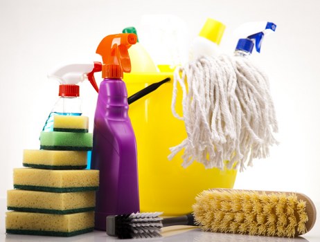 Professional cleaner maintaining a communal landing in a local residential building